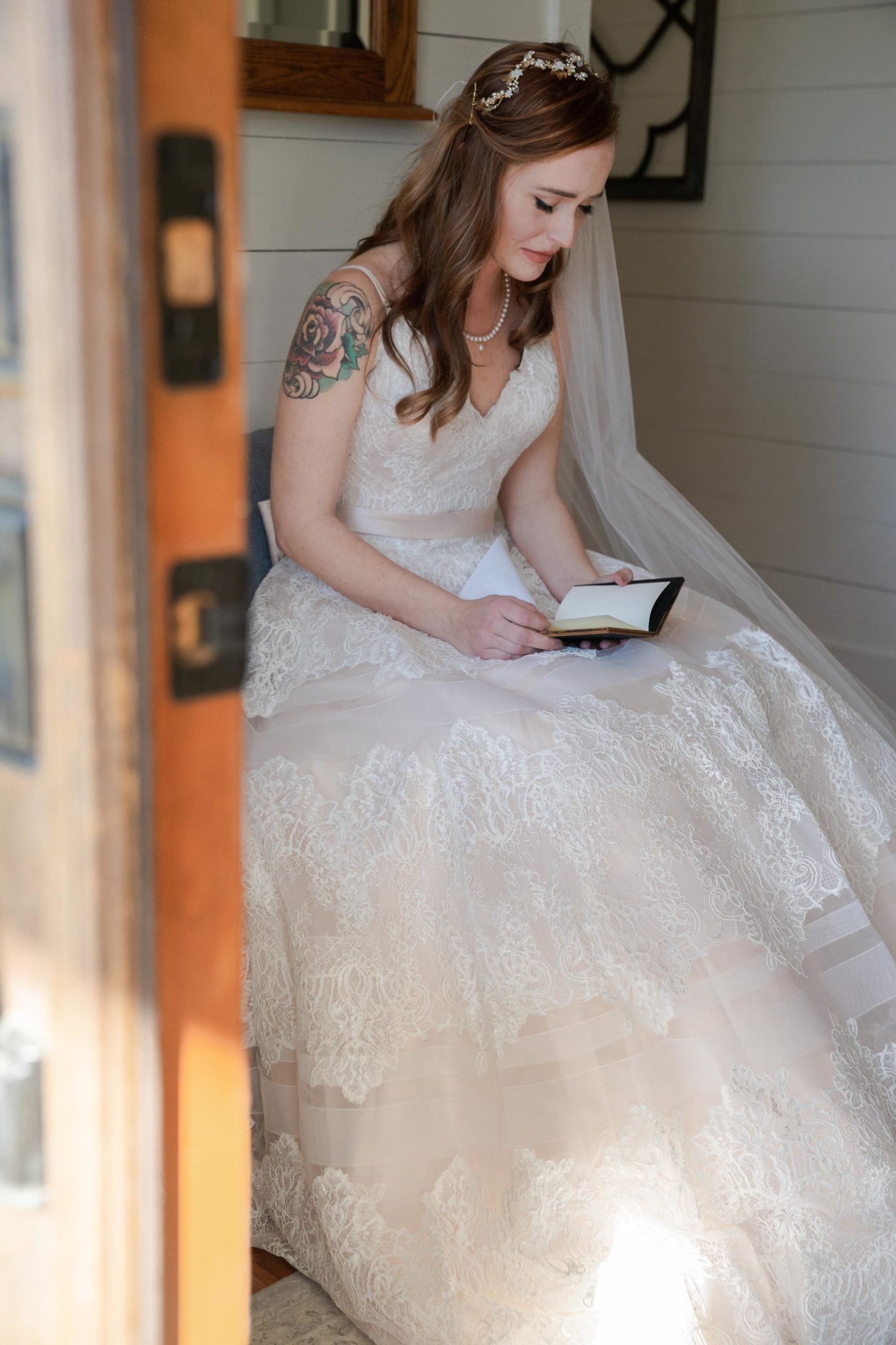 bridal portrait of bride reading the grooms vows at the bluff venue in kingsland georgia