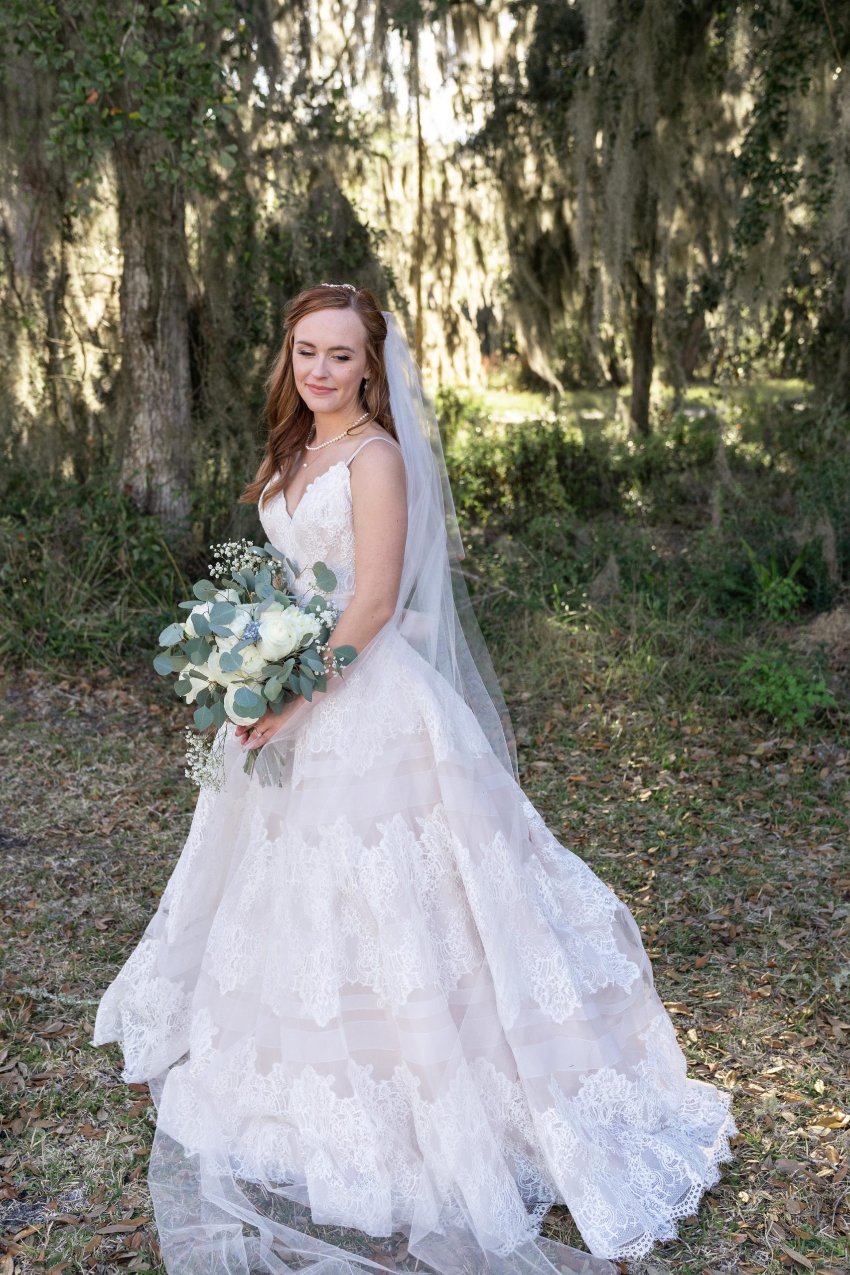 bridal picture with white rose and baby breath bouquet at the bluff venue in kingsland georgia