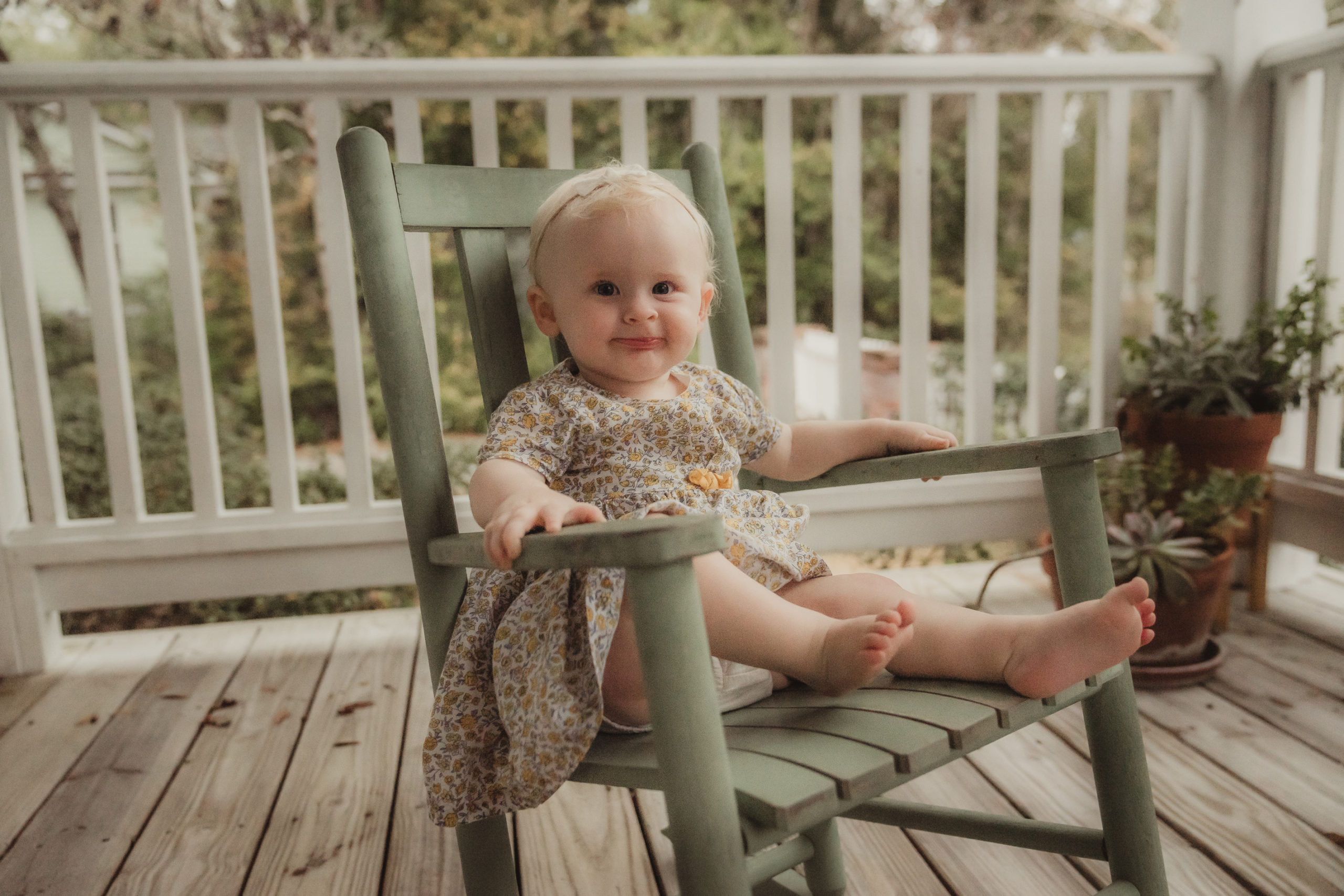 family photographer first birthday session on front porch in St Marys Georgia