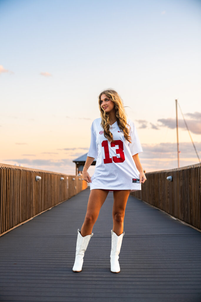 sunset senior portraits in downtown st marys waterfront on a pier