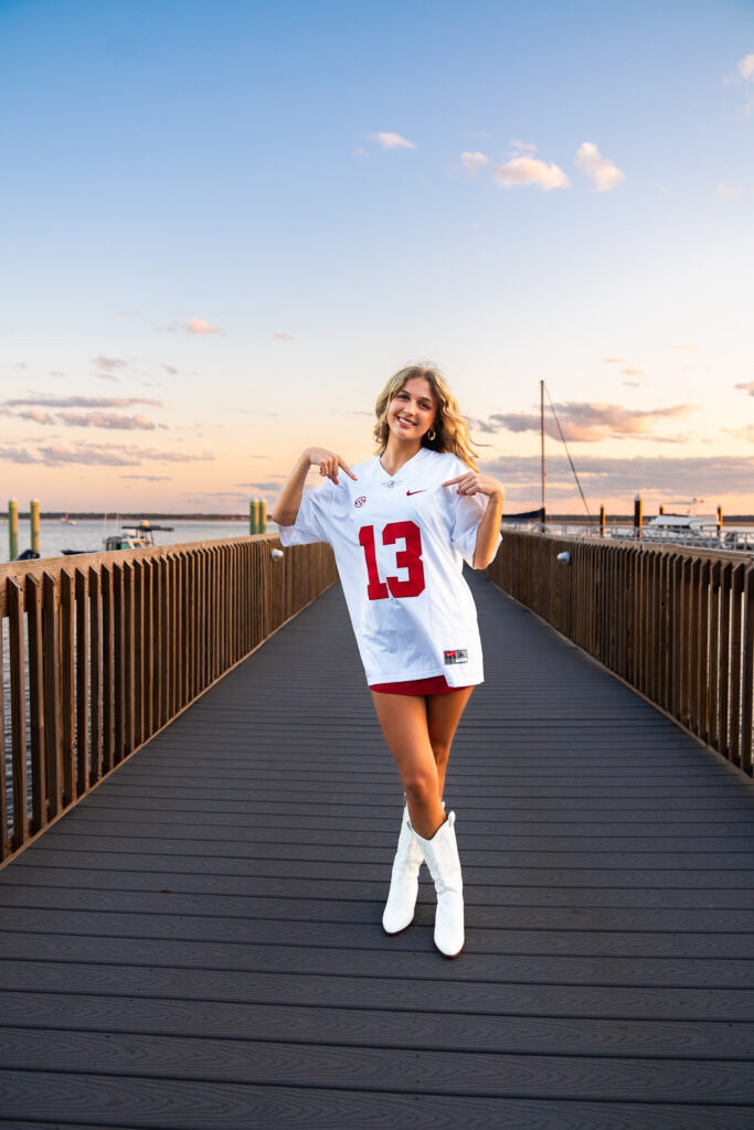 sunset senior portraits in downtown st marys waterfront on a pier