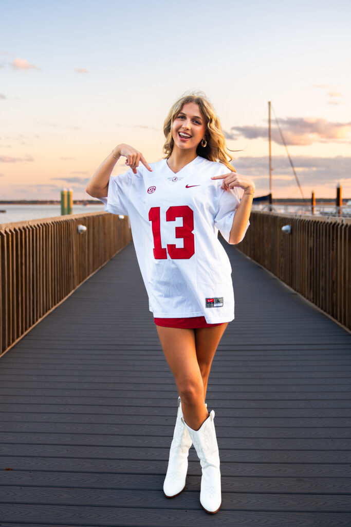 sunset senior portraits in downtown st marys waterfront on a pier