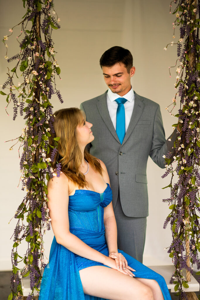 Prom pictures in a white cottage with swing